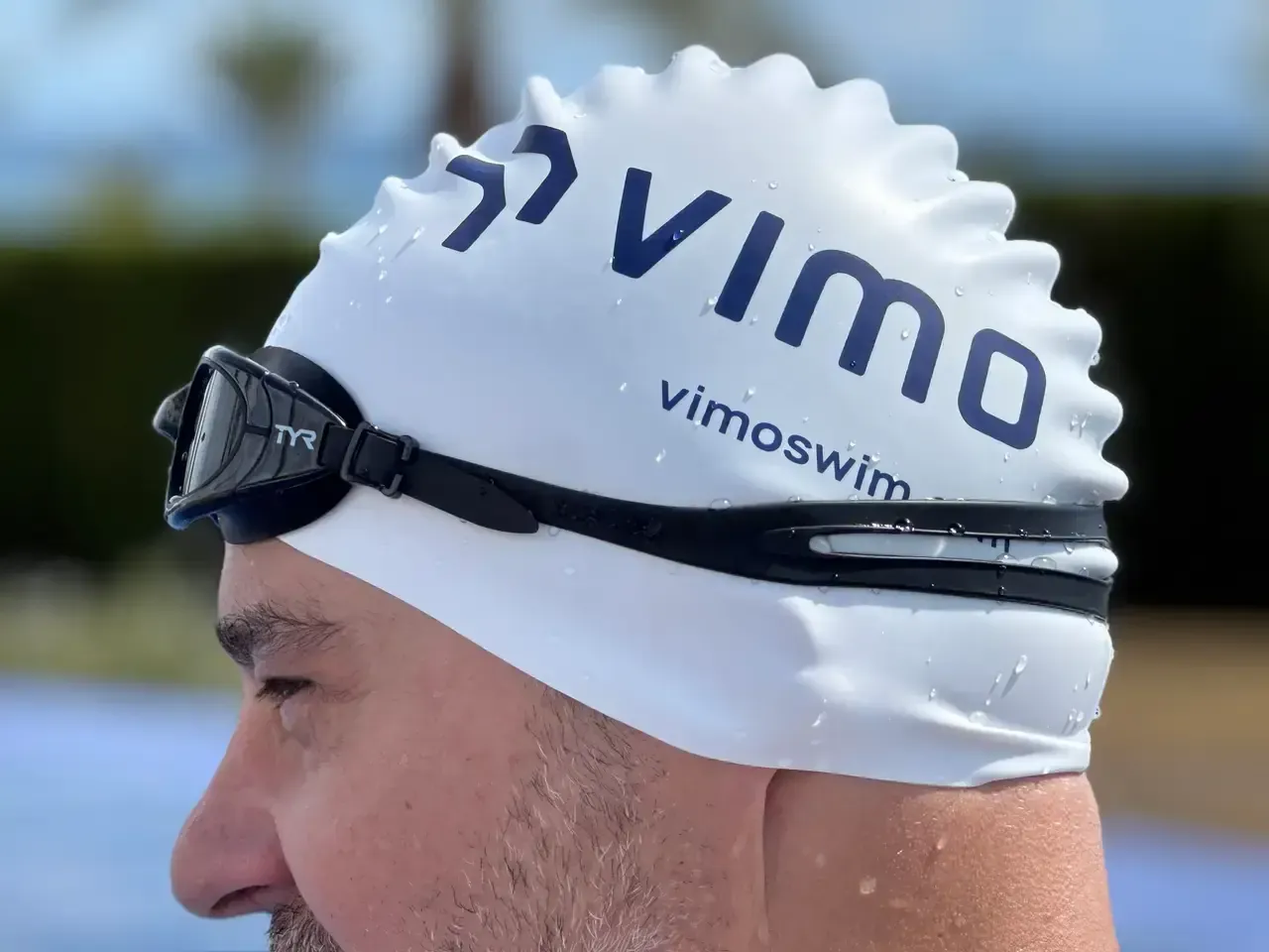 A Vimo device under a swim cap during a session