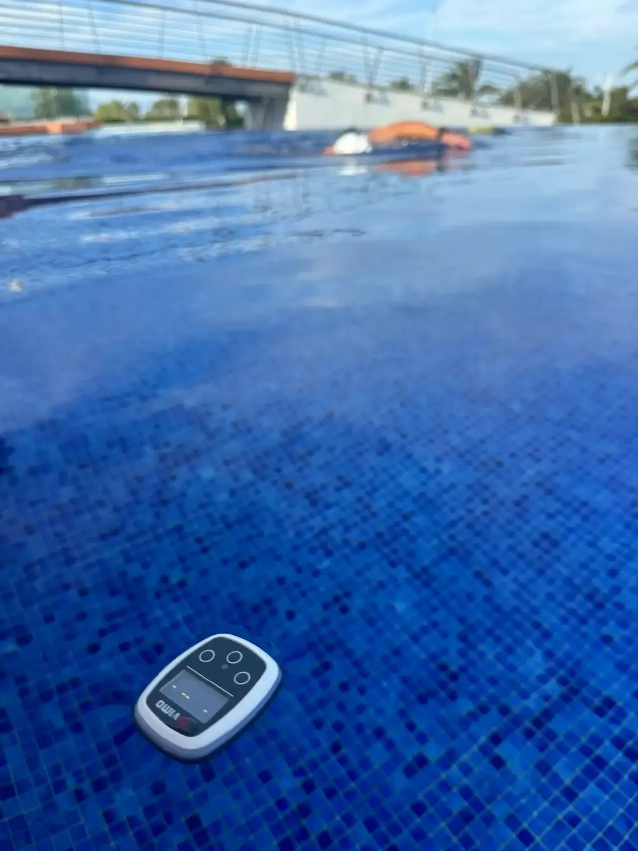 A Vimo device on the pool edge during a session
