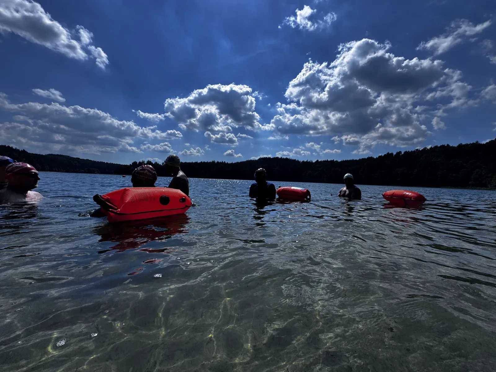 Swimmers regrouping at a buoy during the open water course
