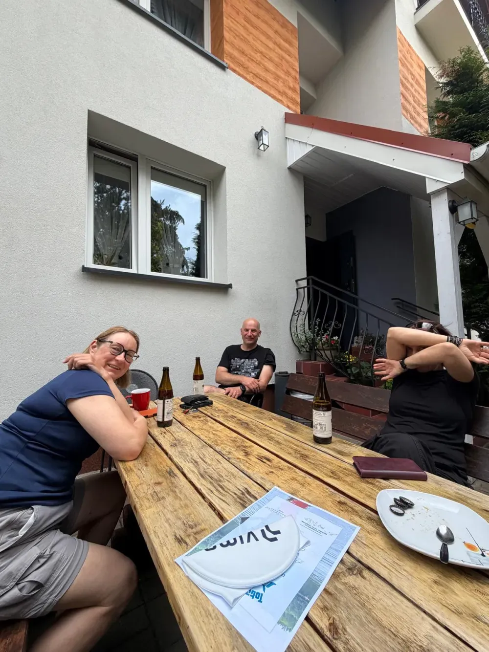 Participants relaxing around the table after a session
