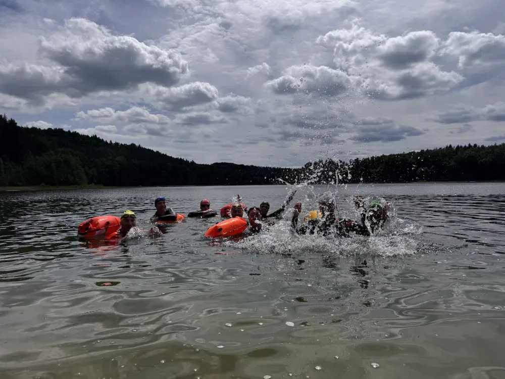 Swimmers splashing during a lake session