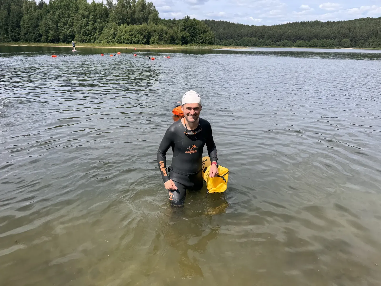 A swimmer heading out for the final challenge on Lake Dąbrowskie