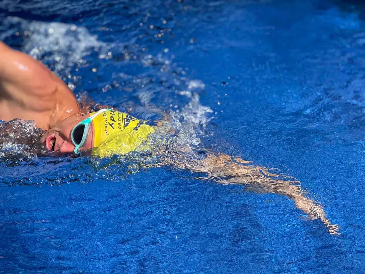 A swimmer taking a breath during the midday pool session