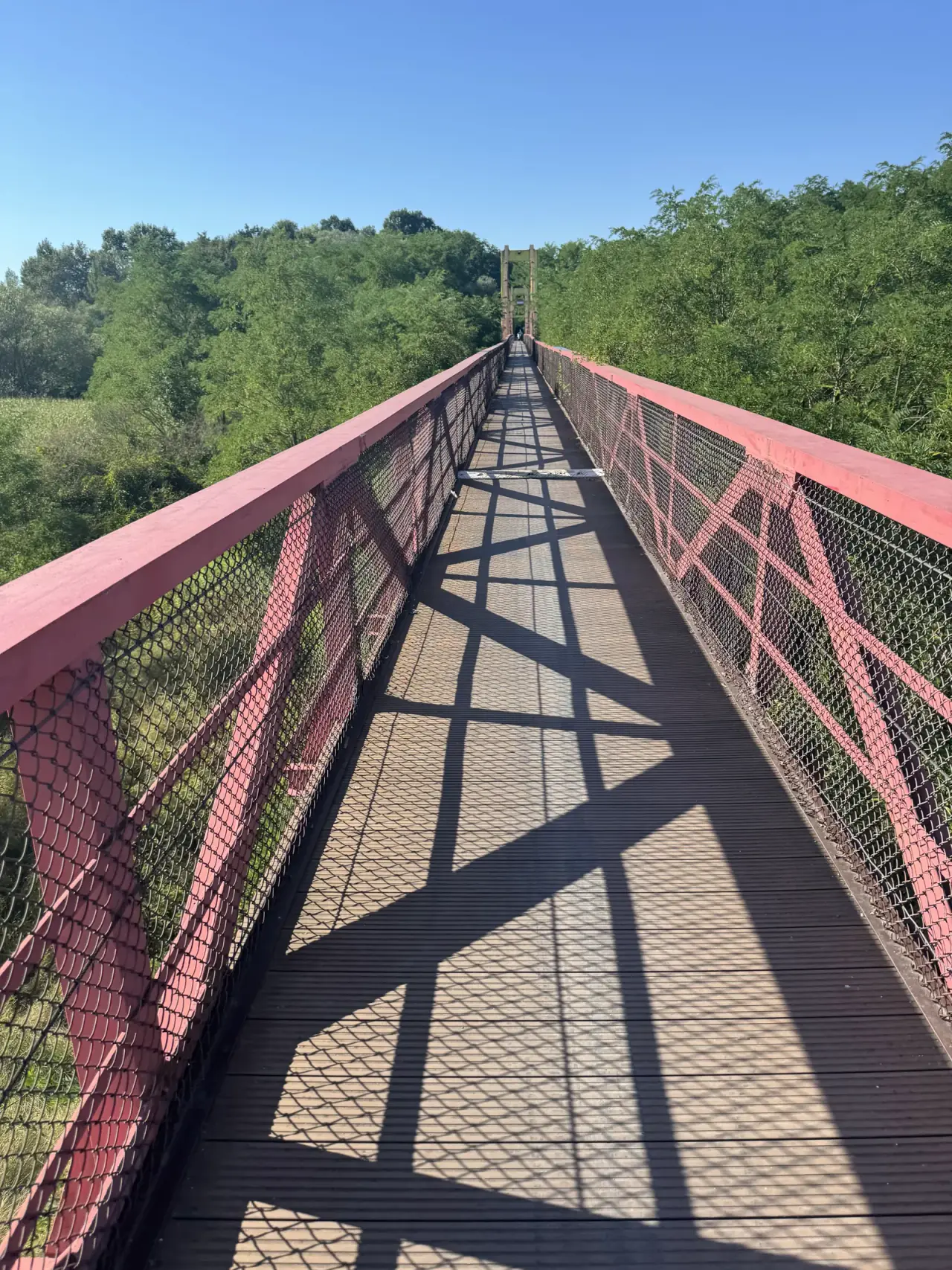 Red truss footbridge across the Vistula