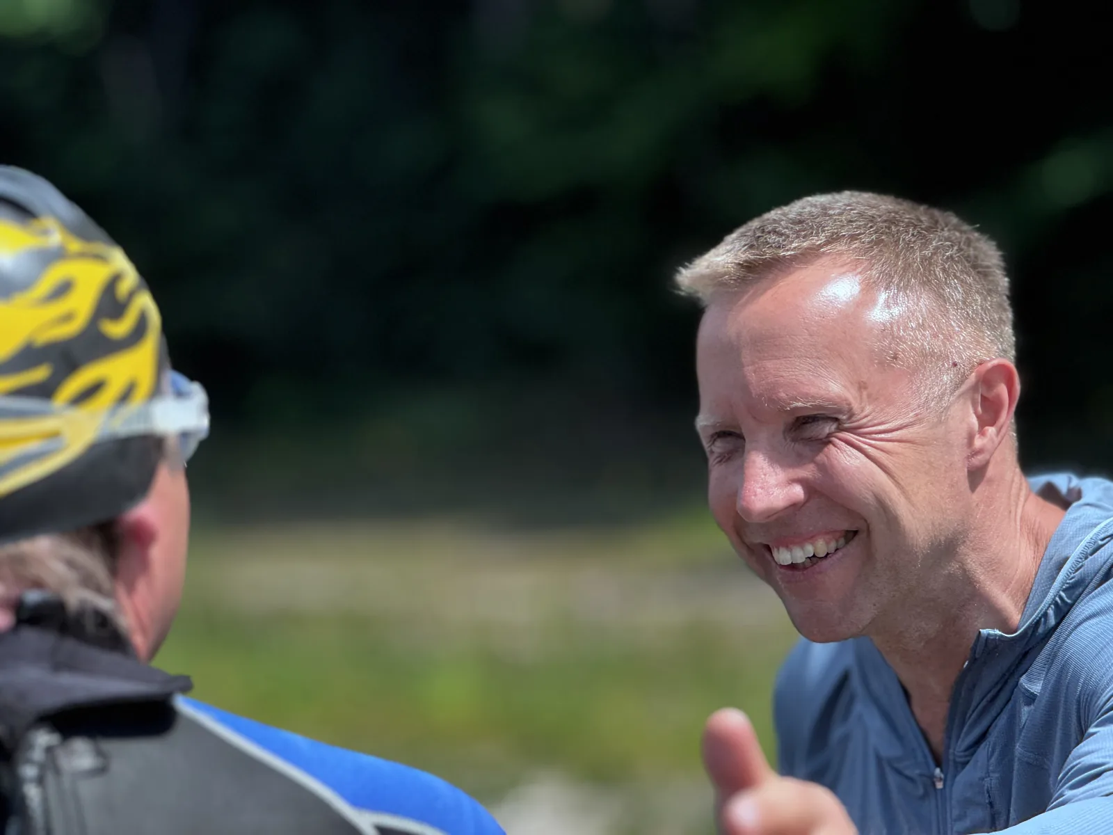 Two participants sharing a laugh during a break at the camp